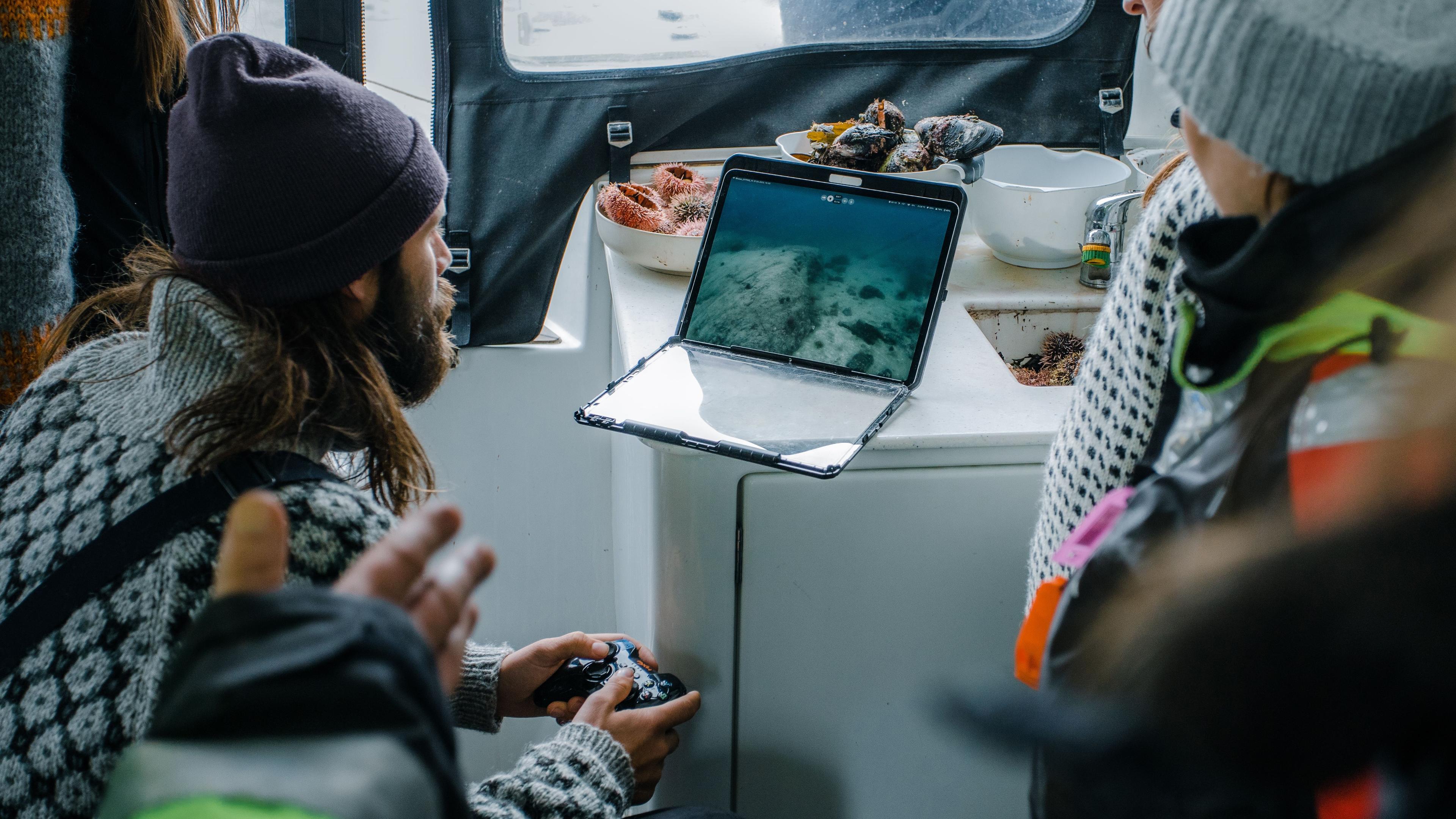 Community planners in Troms, Norway assessing kelp forest ecotourism opportunities to create sustainable coastal livelihoods.