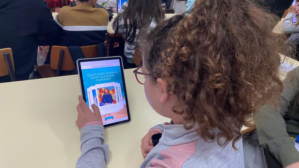 Students in Portugal exploring ocean literacy digital games that encourage sustainable coastal stewardship.