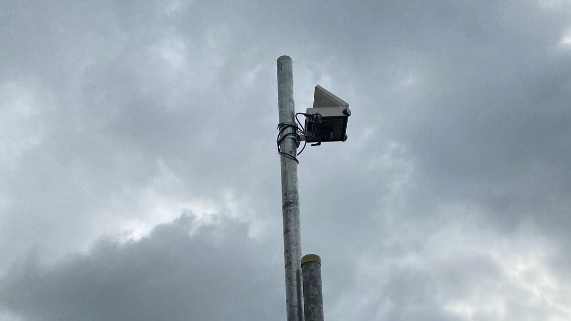Coastal erosion monitoring setup with DGPS tripod and fixed camera tracking shoreline change at Inchydoney Strand, Cork County Ireland.